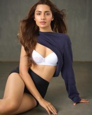 It Happened in Calcutta Actress Anushkaa Luhar in a White T Shirt Bra with a Black High Waisted Shorts and a Navy Blue Knit Sweater Pictures 01