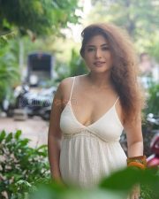 Appealing Poonam Rajput Cleavage in a White V neck Spaghetti Strap Sundress Photos 02