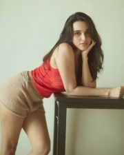 Captivating Actress Nuveksha in a Red Crop Top Beige Shorts Photos 01