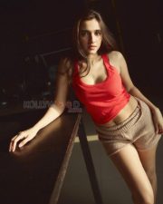 Captivating Actress Nuveksha in a Red Crop Top Beige Shorts Photos 07