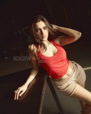 Captivating Actress Nuveksha in a Red Crop Top Beige Shorts Photos 08