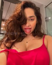 Sultry Aditi Mistry Cleavage in a Red Cami Top Photos 01