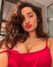 Sultry Aditi Mistry Cleavage in a Red Cami Top Photos 02