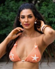 Alluring Manmeet Kaur Virk Cleavage in a Orange Crochet Bikini Top Photos 04