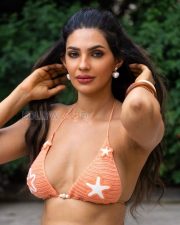 Alluring Manmeet Kaur Virk Cleavage in a Orange Crochet Bikini Top Photos 08
