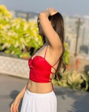 Dazzling Actress Hritiqa Chheber in a Red Spaghetti Strap Crop Top And White Palazzo Pants Photos 03