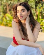 Dazzling Actress Hritiqa Chheber in a Red Spaghetti Strap Crop Top And White Palazzo Pants Photos 04