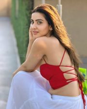 Dazzling Actress Hritiqa Chheber in a Red Spaghetti Strap Crop Top And White Palazzo Pants Photos 06