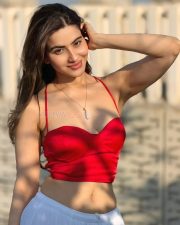 Dazzling Actress Hritiqa Chheber in a Red Spaghetti Strap Crop Top And White Palazzo Pants Photos 08