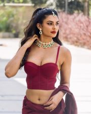 Fashionable Actress Manmeet Kaur in a Maroon Crop Top and White Pleated Skirt Photos 01