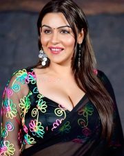 Glamorous Actress Yamini Malhotra in a black V neck crop top with drop earrings photos 01