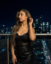 Seductive Kheyali Nath Cleavage in a Black Lace Bodysuit And Leather Mini Skirt Photos 06