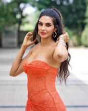 Tempting Manmeet Kaur Virk Cleavage in a Orange Lace Strapless Bodycon Dress Photos 04