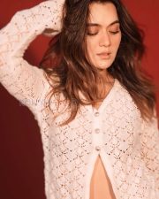 Bold Actress Araddhana Sharma in a White Crochet Open Cardigan and Mini Skirt Photos 02