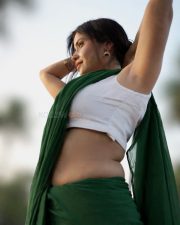 Graceful Actress Rosyy Satpathyy in a Green Saree White Blouse Photos 02