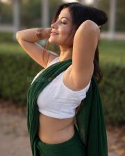 Graceful Actress Rosyy Satpathyy in a Green Saree White Blouse Photos 09