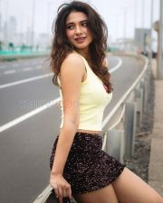 Radiant Actress Natasha Bharadwaj in a Yellow Crop Top and Sequin Shorts Photos 05
