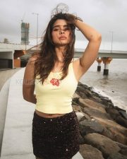 Radiant Actress Natasha Bharadwaj in a Yellow Crop Top and Sequin Shorts Photos 09