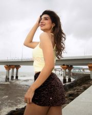 Radiant Actress Natasha Bharadwaj in a Yellow Crop Top and Sequin Shorts Photos 10