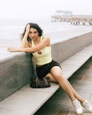 Radiant Actress Natasha Bharadwaj in a Yellow Crop Top and Sequin Shorts Photos 11