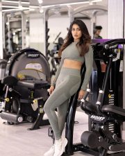Striking Actress Poornima Ravi in a Olive Grey Gym Crop Top and Leggings Photos 01