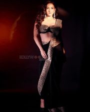 Glam Neeti Mohan in a Sequinned Black Saree Photos 03