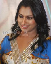 Glamorous Actress Malavika in a Blue Gold Baroque Print Dress Photos 05