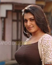 Glamorous Actress Malavika in a Brown Tank Top And Coin Shrug Photos 24
