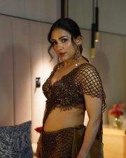 Intriguing Singer Neeti Mohan in a Metallic Bronze Sequined Bralette Style Top with a Brown Floor Length Skirt Pictures 01