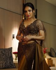 Intriguing Singer Neeti Mohan in a Metallic Bronze Sequined Bralette Style Top with a Brown Floor Length Skirt Pictures 05