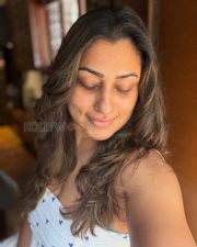 Natural Actress Malavika in a White Printed Sleeveless Top Photos 02